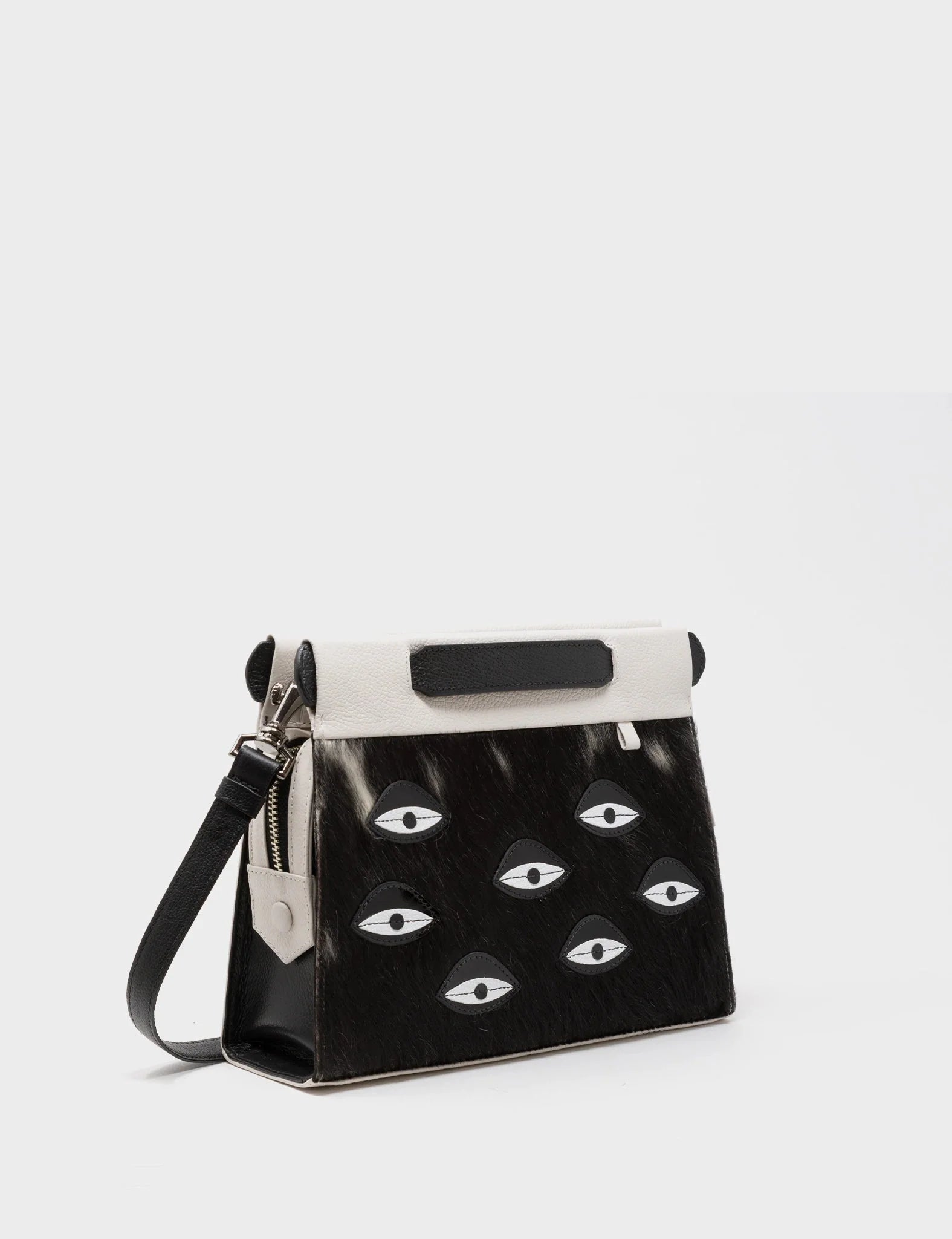 Vali Crossbody Small Cream Leather Bag - Eyes Applique Adjustable Handle - Front corner angle view